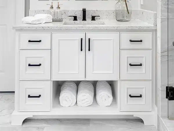 A simple vanity with dark hardware
